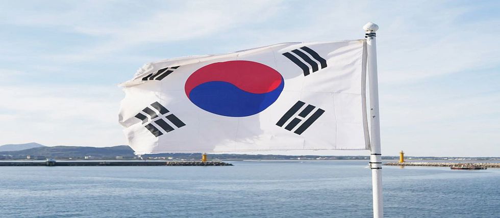 The South Korean flag flying from a mast